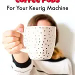 Woman holding white coffee cup with gold polka dots in front of her face