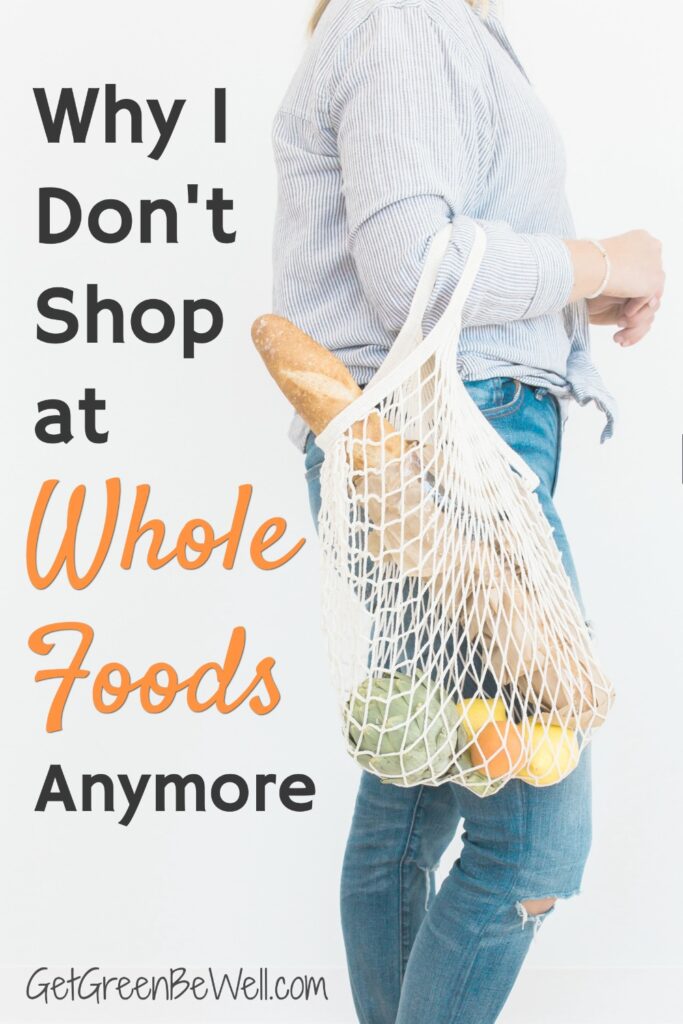 woman holding mesh grocery bag full of produce and bread