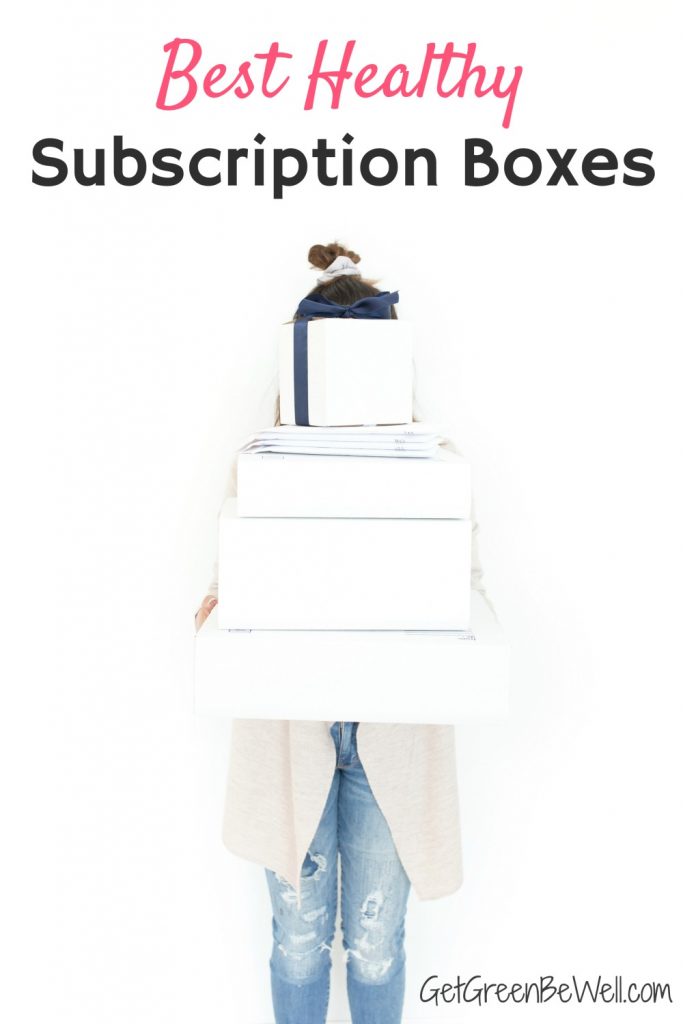 woman holding white boxes in front of her