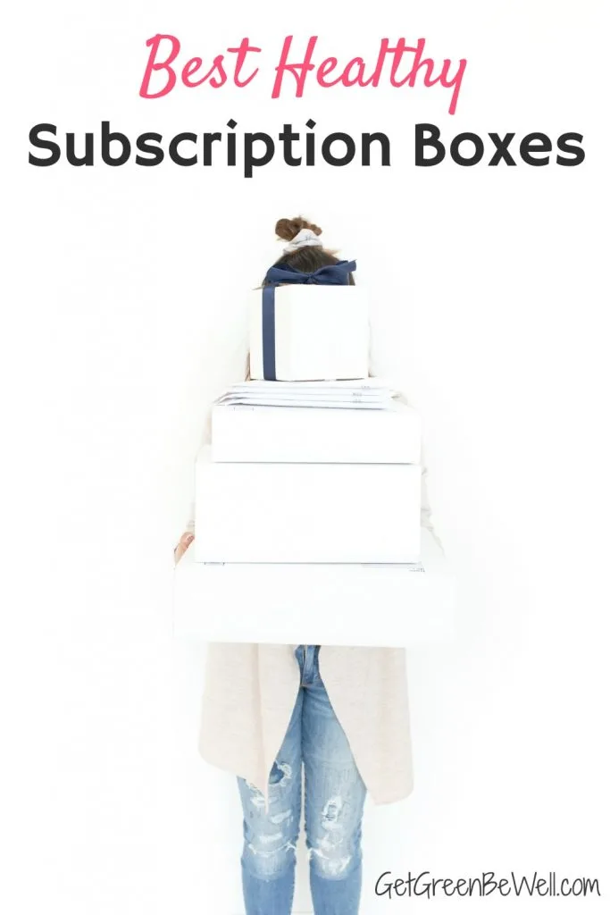 woman holding white boxes in front of her