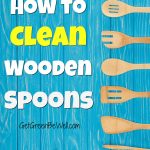 blue wooden background with wooden spoons and wood spatulas