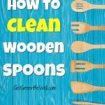 blue wooden background with wooden spoons and wood spatulas