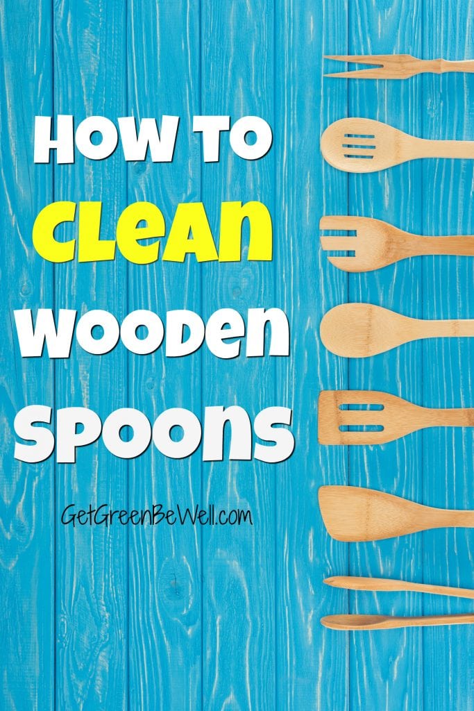 blue wooden background with wooden spoons and wood spatulas