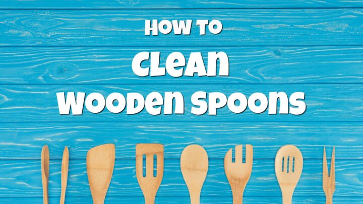 blue wooden background with wooden spoons and wood spatulas