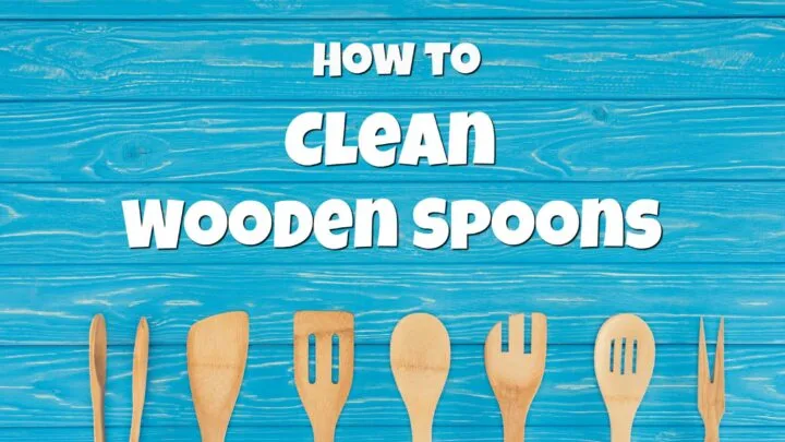 blue wooden background with wooden spoons and wood spatulas