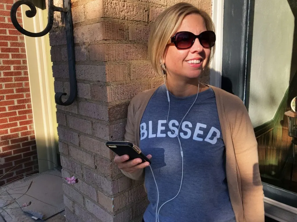 woman on a daily walk wearing a t-shirt that says blessed