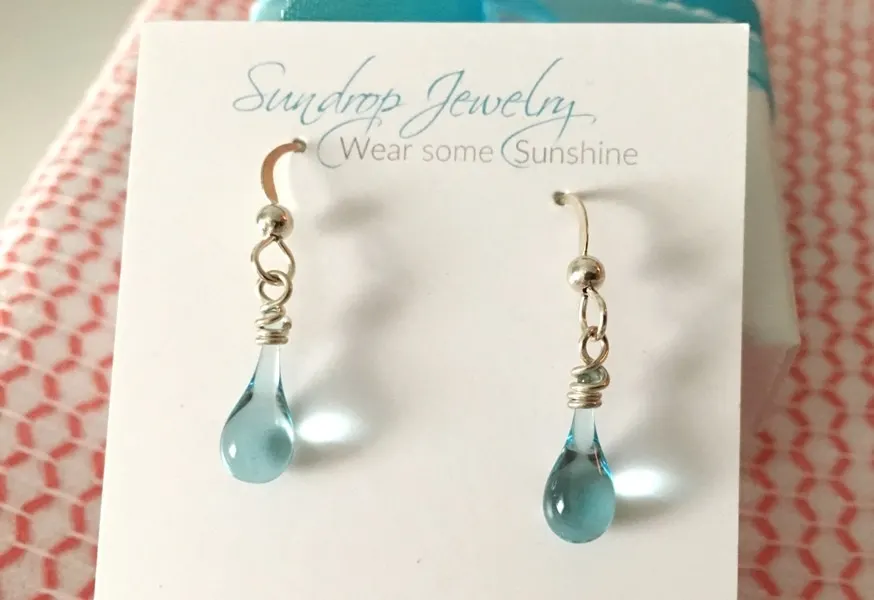 earrings made from recycled glass melted by sun and magnifying glass