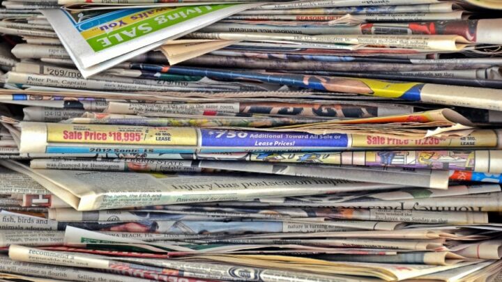 stack of newspapers to be used as mulch in the garden