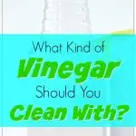 clear glass bottle of vinegar on white background
