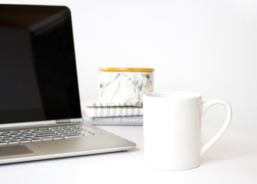 Computer with Coffee Cup and Books