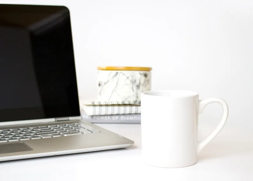 Computer with Coffee Cup and Books