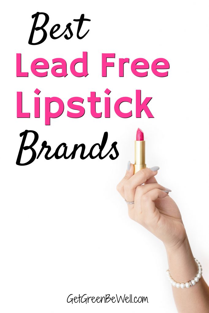 woman holding up tube of pink lipstick against white background