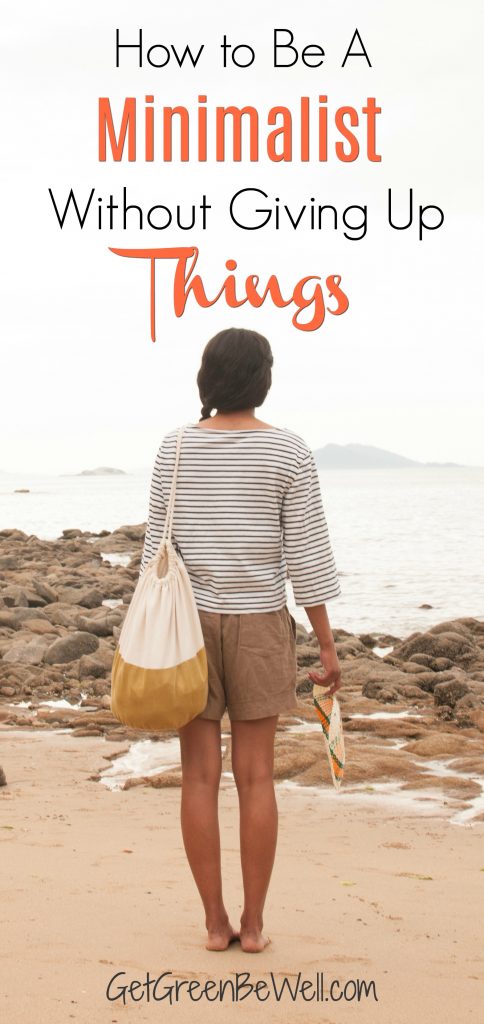 Girl Standing at Beach with one bag looking into ocean 