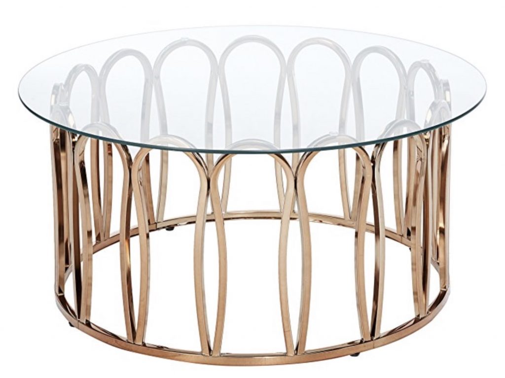 Chrome brass base of a coffee table with clear glass top