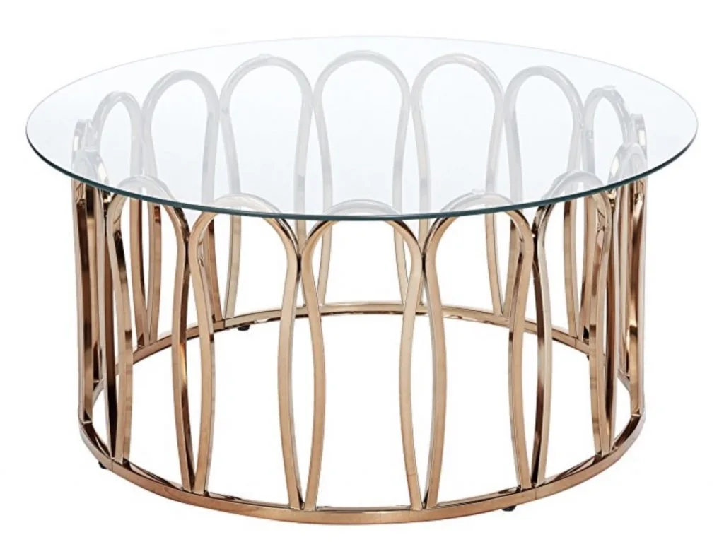Chrome brass base of a coffee table with clear glass top