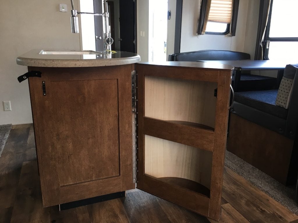 kitchen island storage shelves in an RV