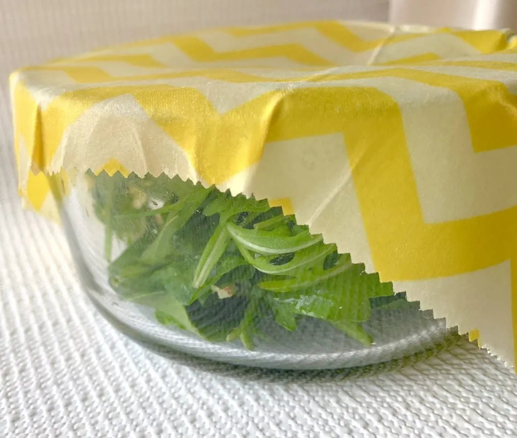 beeswax wrap on glass bowl with salad