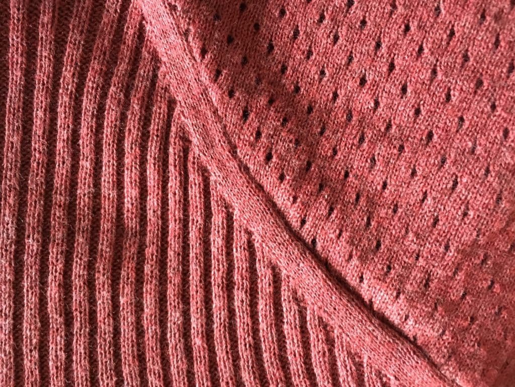 organic cotton sweater closeup details of raglan shoulder ribbing and pointelle 