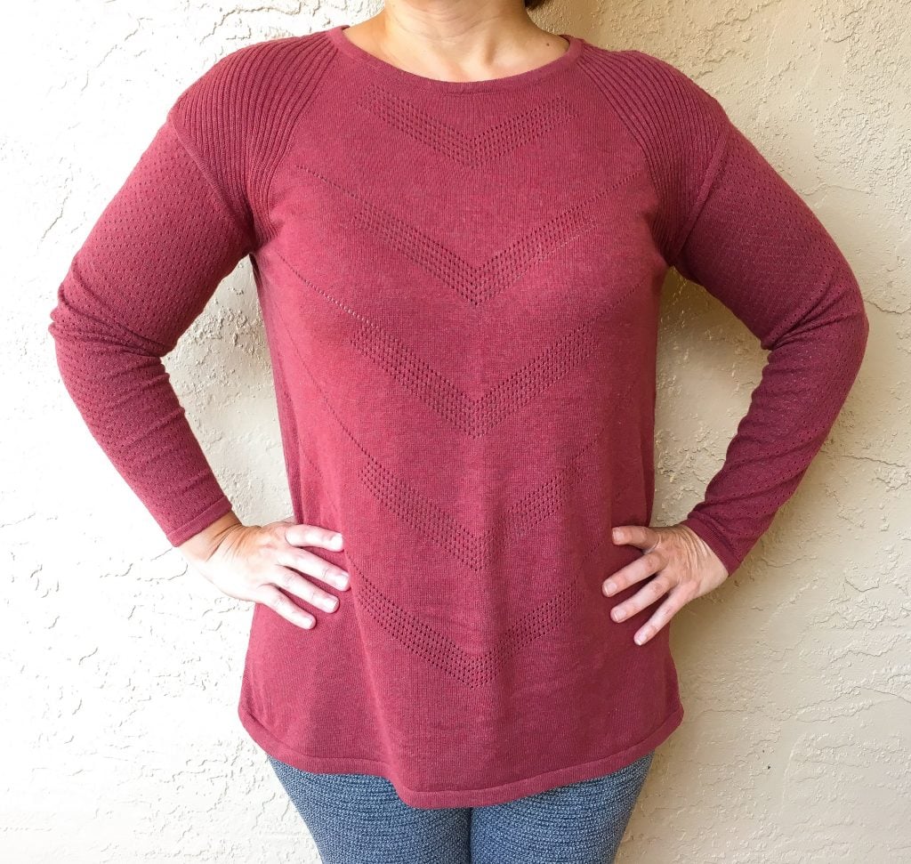 prana mulled wine heather mainspring sweater against wall