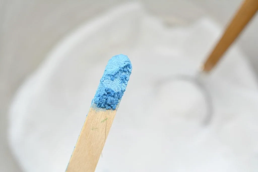 blue mica natural coloring powder on wooden stick