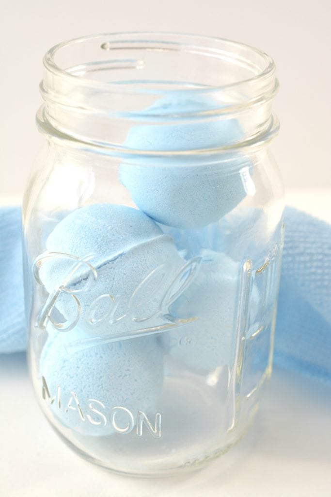 blue peppermint round toilet bowl cleaner tablets in glass mason jar