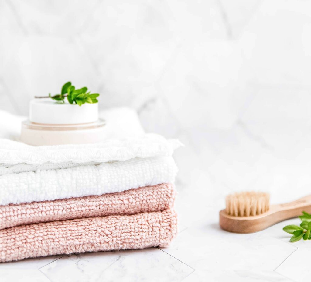 white and pink hand towels in bathroom