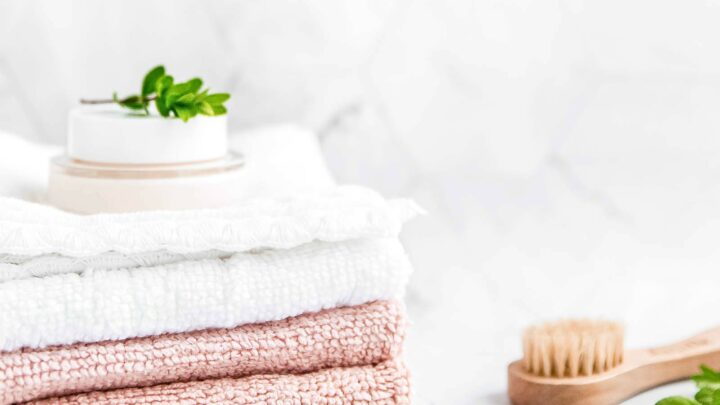 white and pink hand towels in bathroom