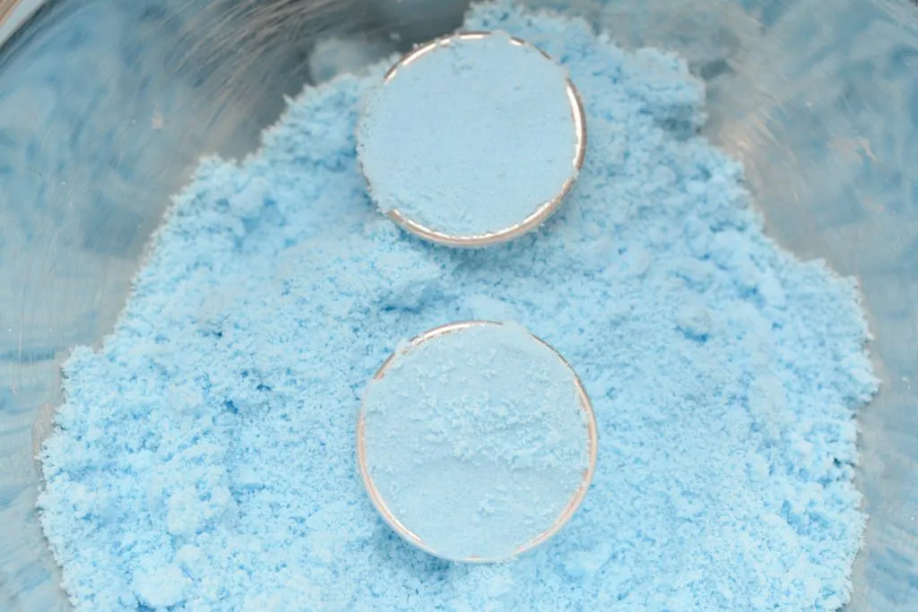 silver metal ball molds filled with blue powder mixture for toilet bowl cleaner tablets