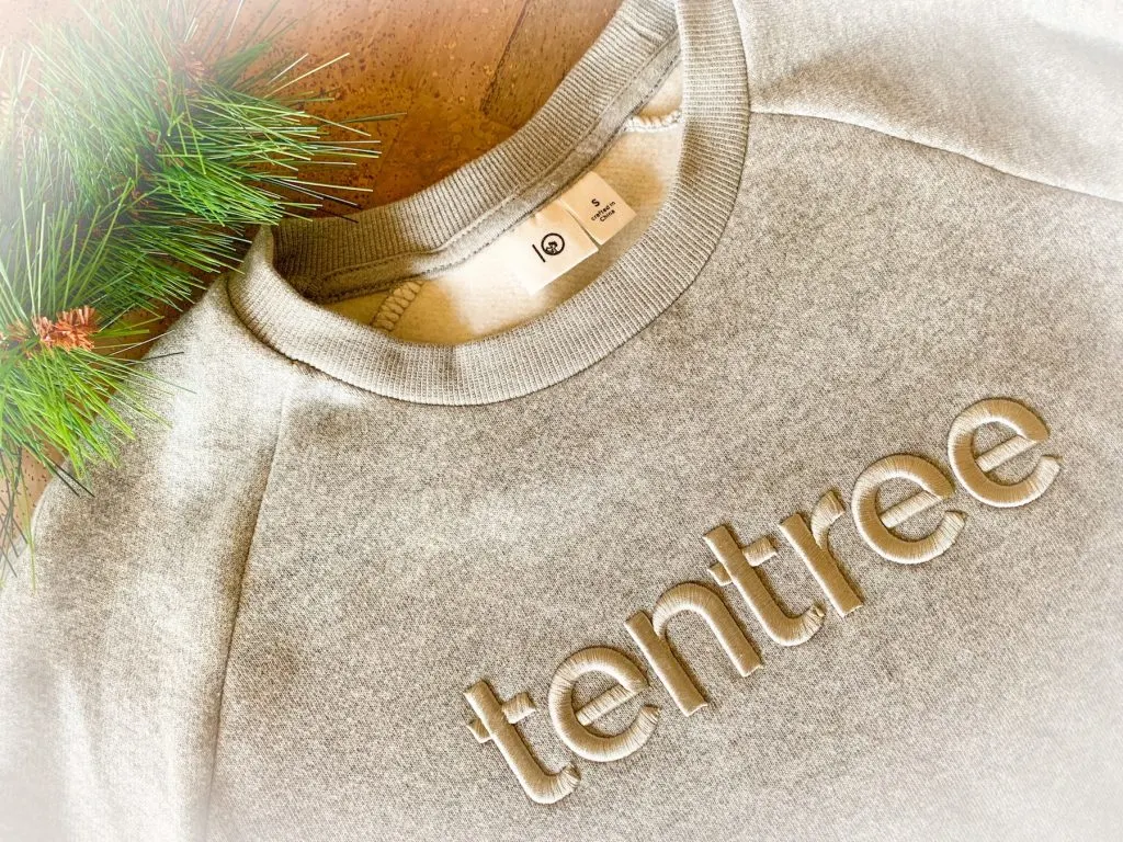 tentree grey sweatshirt on cork background review sustainable fashion clothing