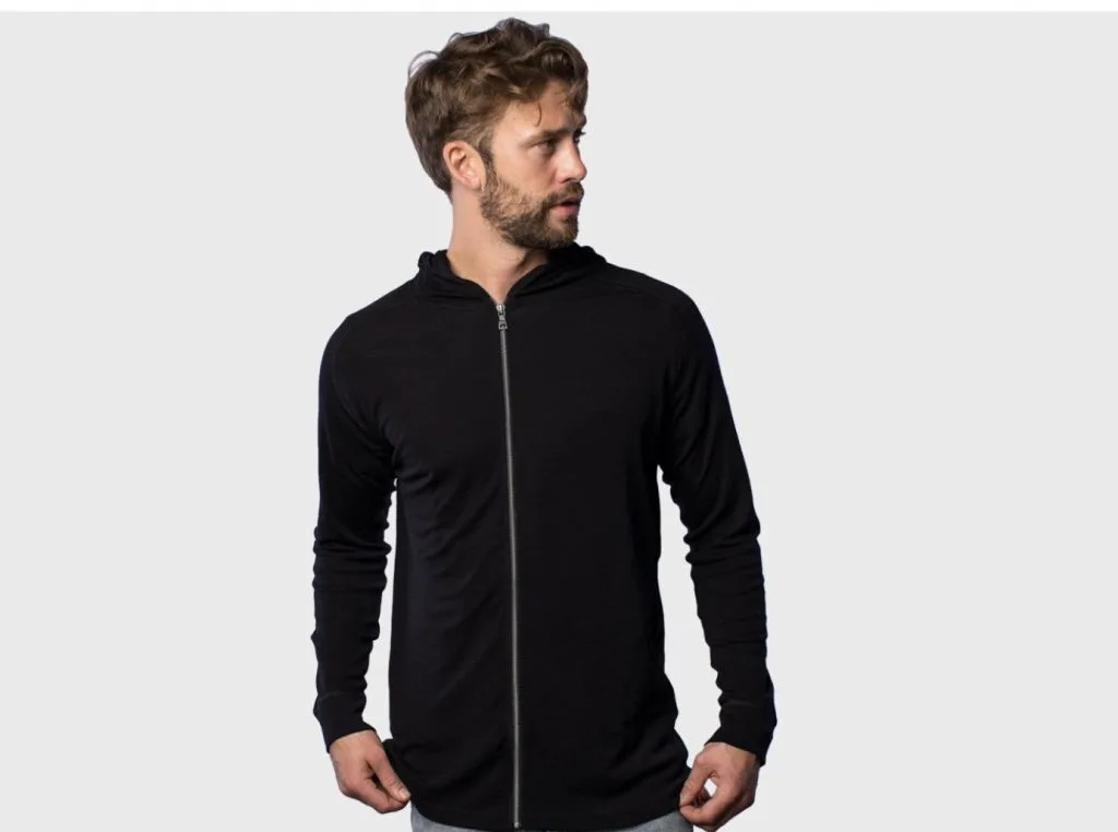 man wearing black hoodie minimalist clothing