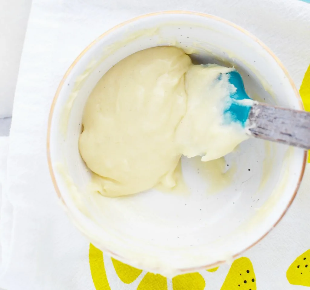 white ceramic bowl with winter skin care balm and spatula DIY 