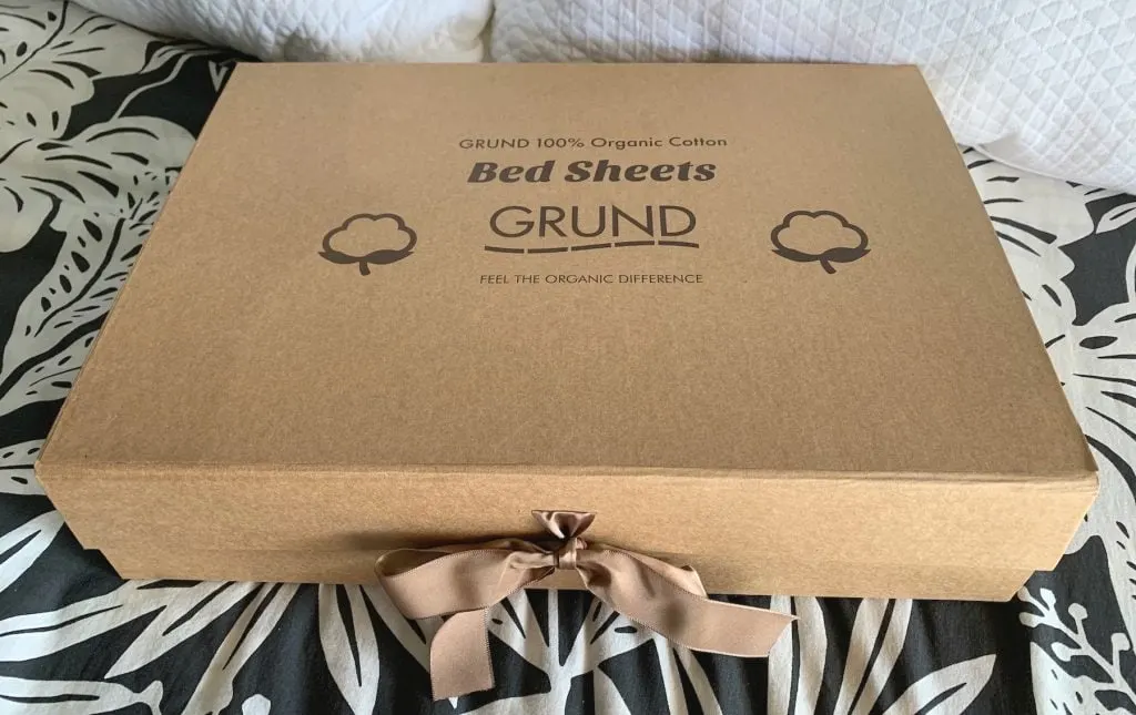 grund America organic cotton bed sheets box tied with brown ribbon bow