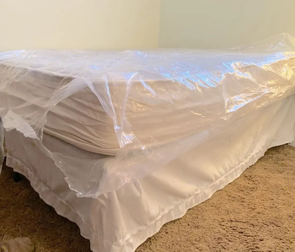 joybed mattress wrapped in plastic on bed frame