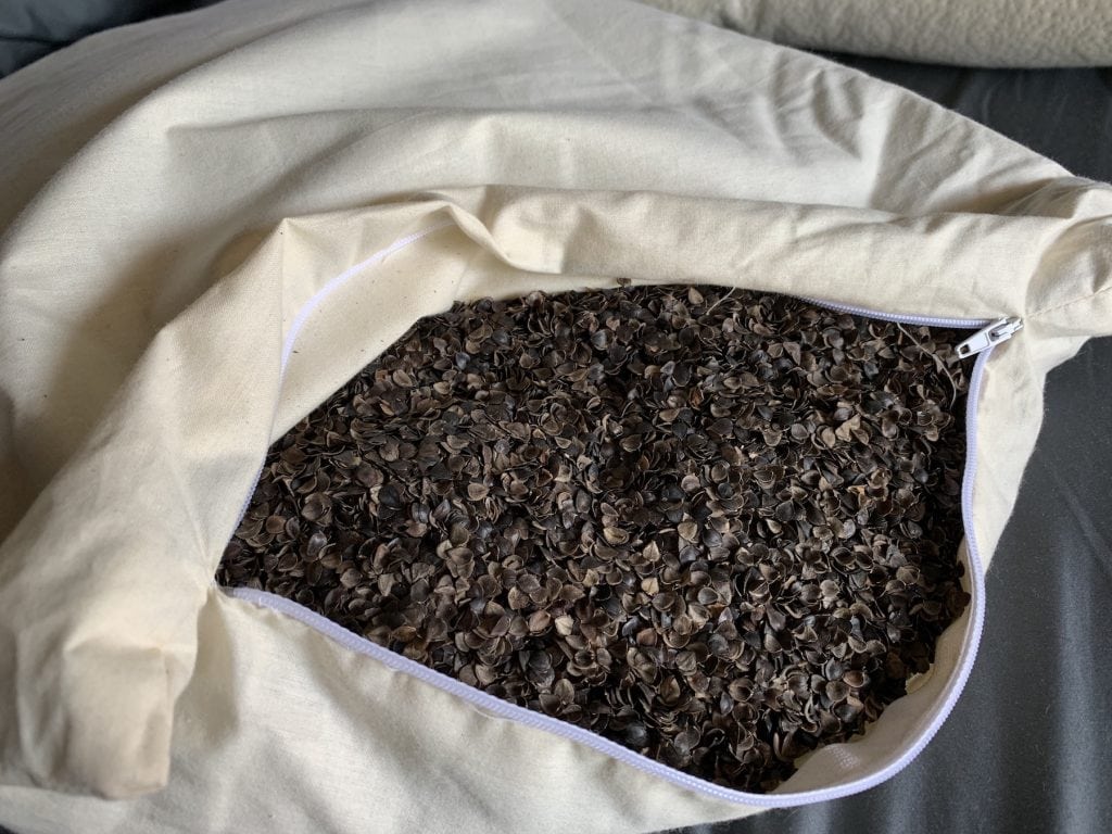 organic buckwheat hull pillow opened with cotton cover