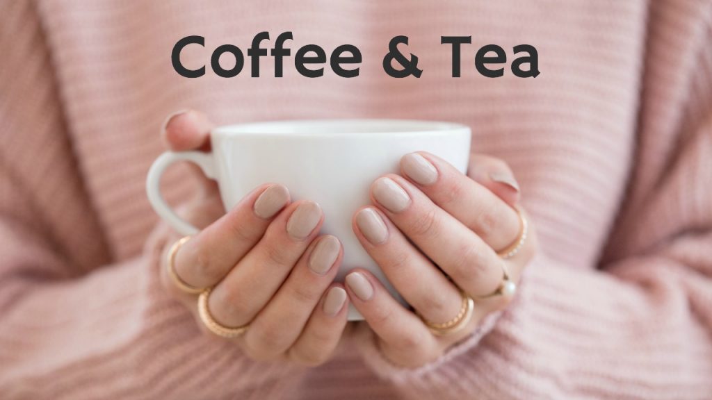 woman hands holding white coffee mug against pink sweater zero waste tips