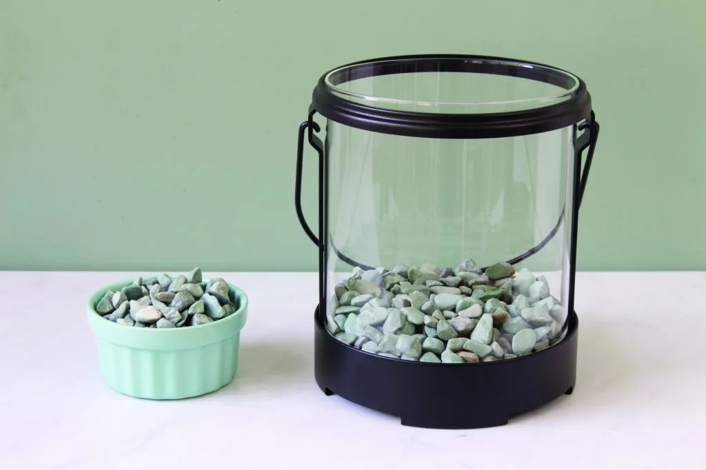 glass lantern filled with pebbles for terrarium