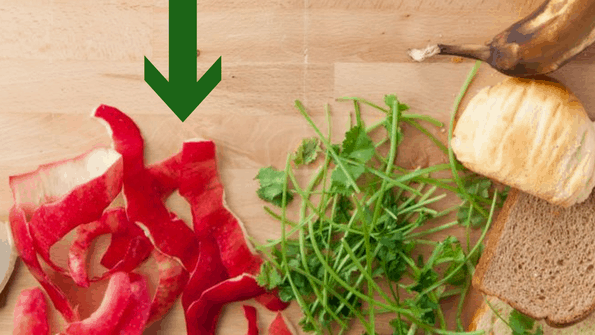 apple peels and parsley stems on wood board