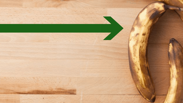 rotting bananas food waste on wood board
