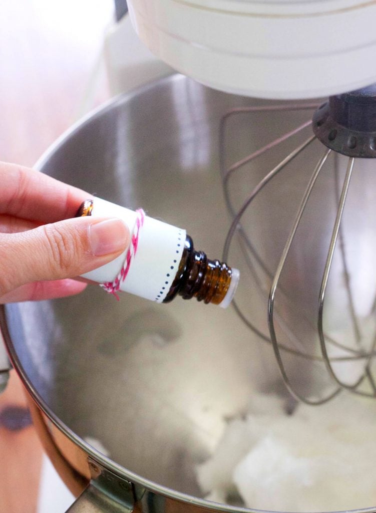 essential oil bottle and coconut oil in a mixer