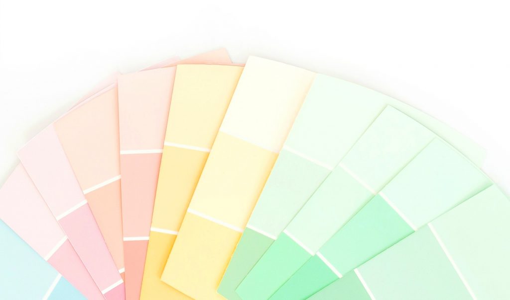 paint samples in pastel colors against white background