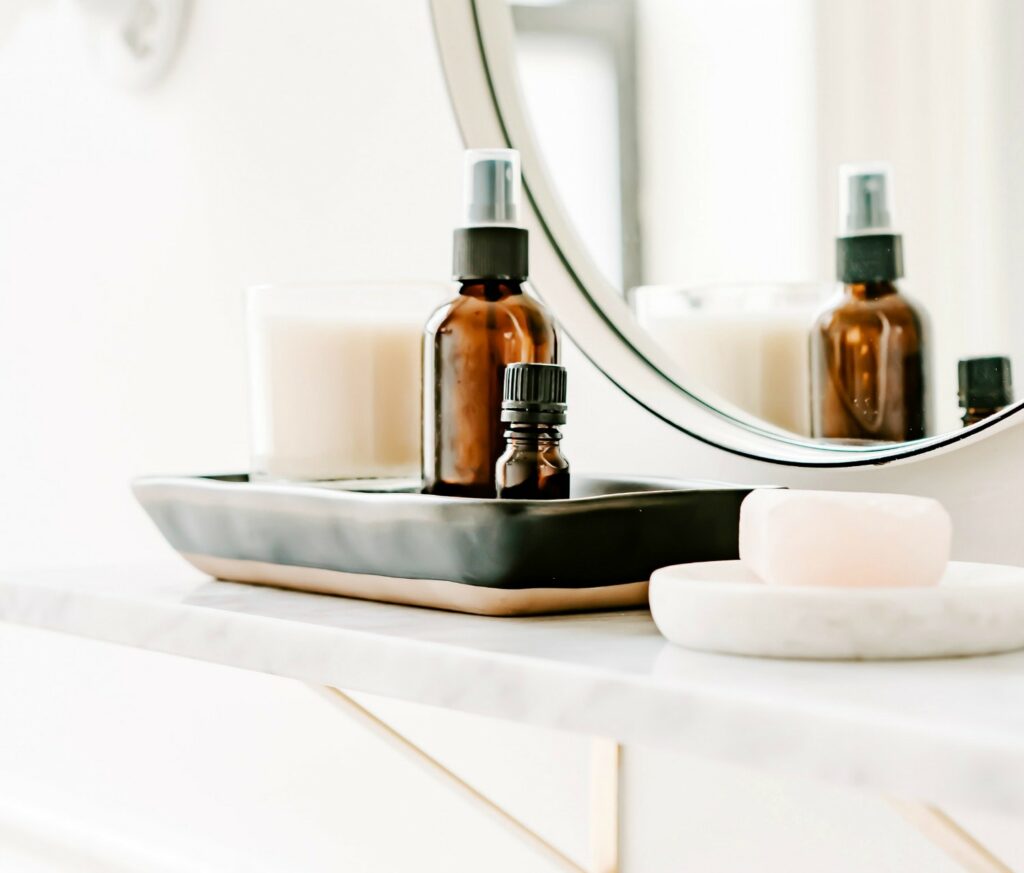 brown glass bottle of oil on bathroom shelf 