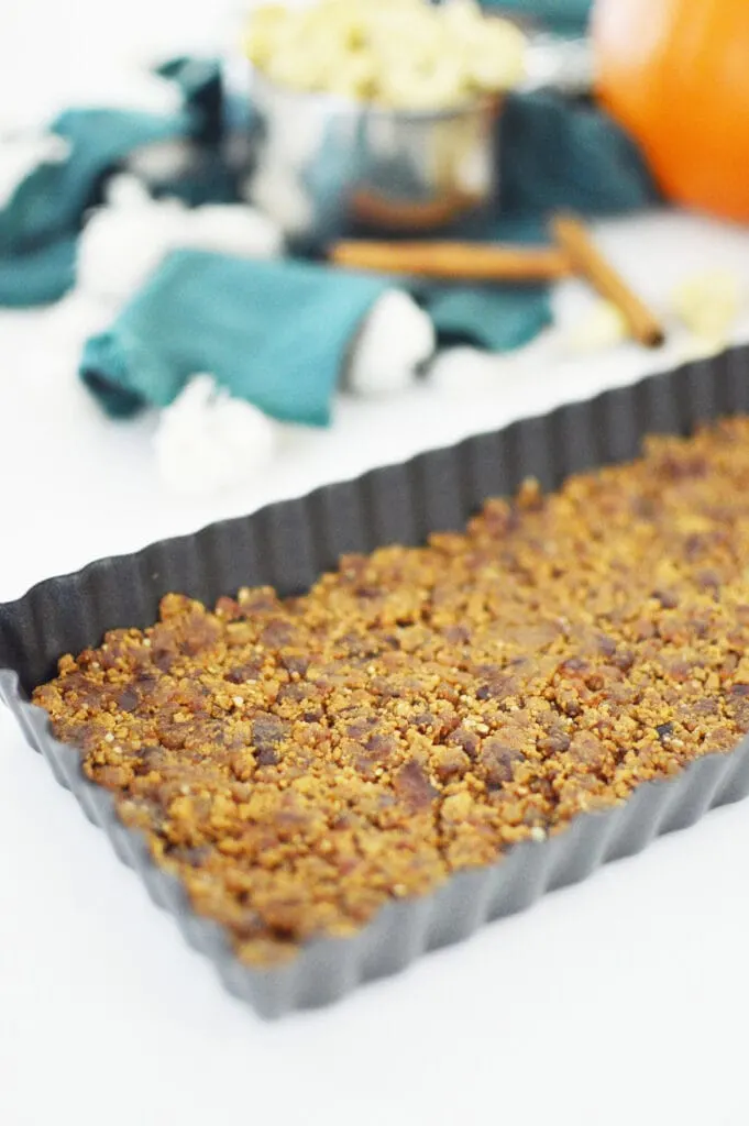 graham cracker and date vegan crust in tart pan