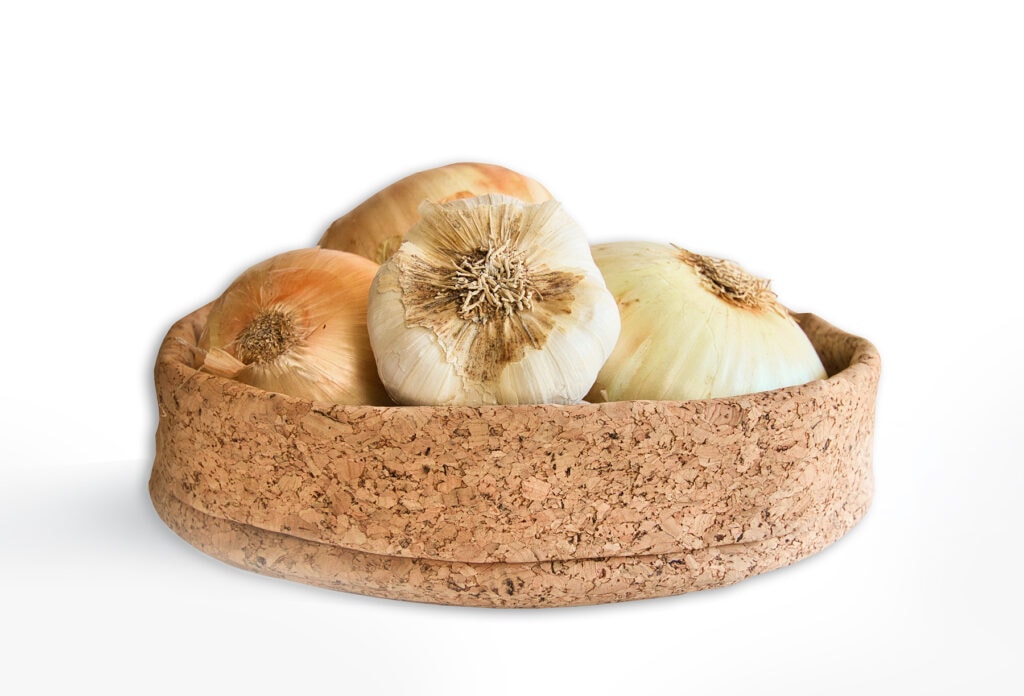 cork bowl holding garlic 