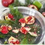 Christmas stovetop potpourri with pine needles pomegranate lime in steel pot