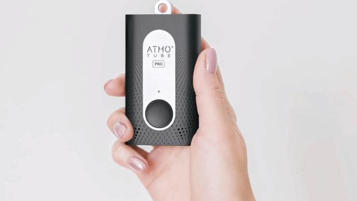 woman's hand holding atmotube pro personal indoor air quality monitor