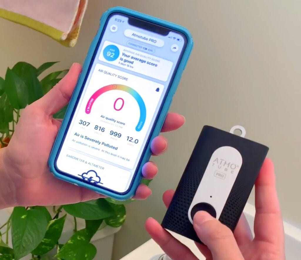 Atmotube air quality monitor in hand