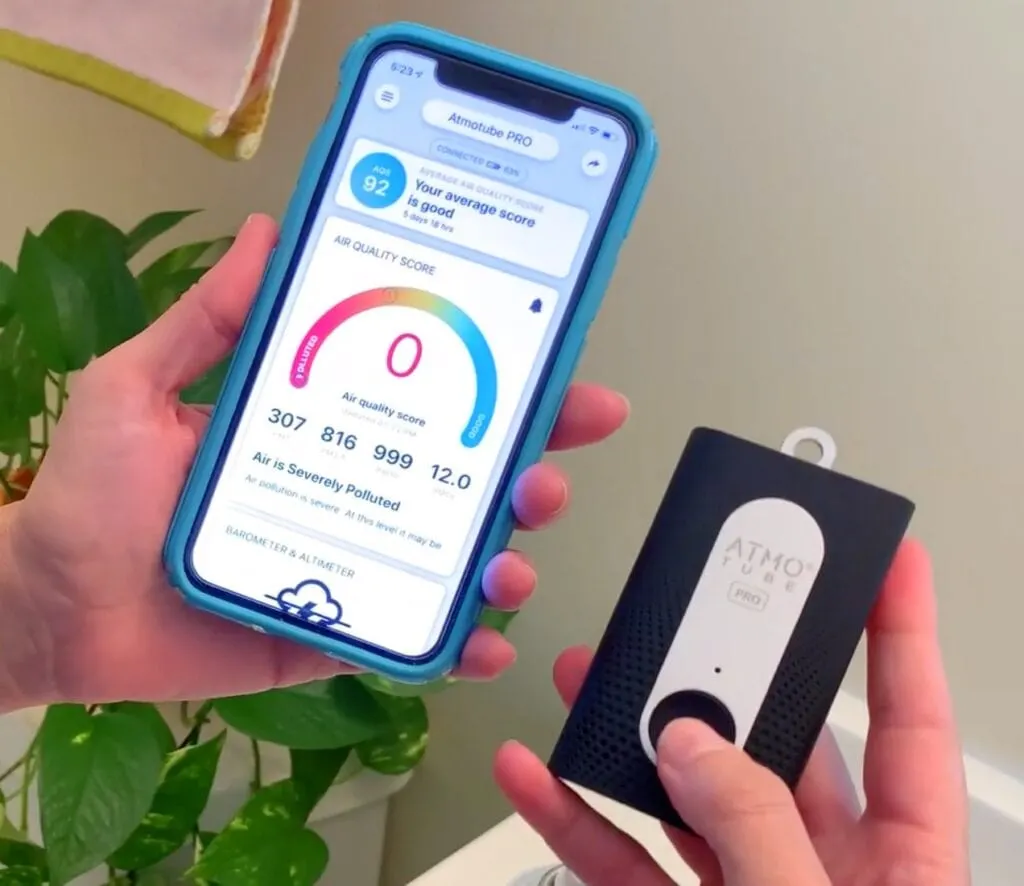Atmotube air quality monitor in hand