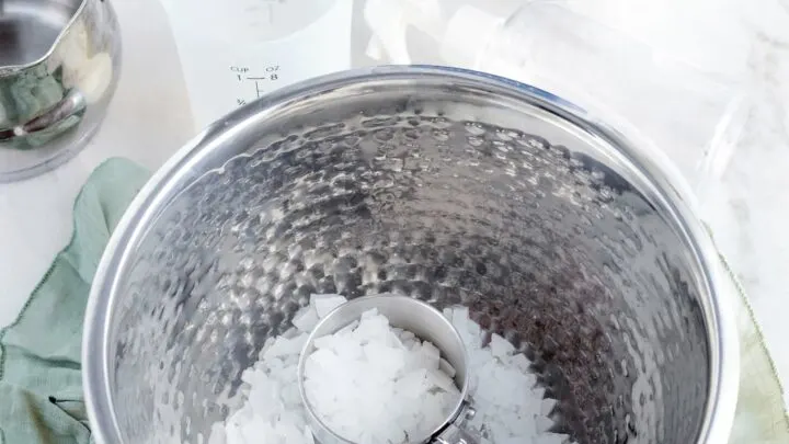 magnesium flakes in silver bowl for magnesium topical spray recipe
