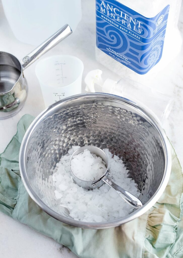 magnesium flakes in silver bowl for magnesium topical spray recipe