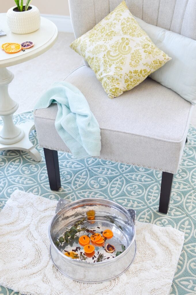 chair on rug with foot basin filled with water